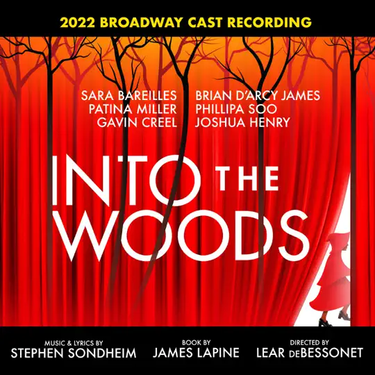 Cover art for the Into the Woods CD. It shows the title in large white letters against the backdrop of a large curtain in red. Shadowy tall trees are seen behind. Little Red Riding Hood is skipping off behind the curtain to the lower right.